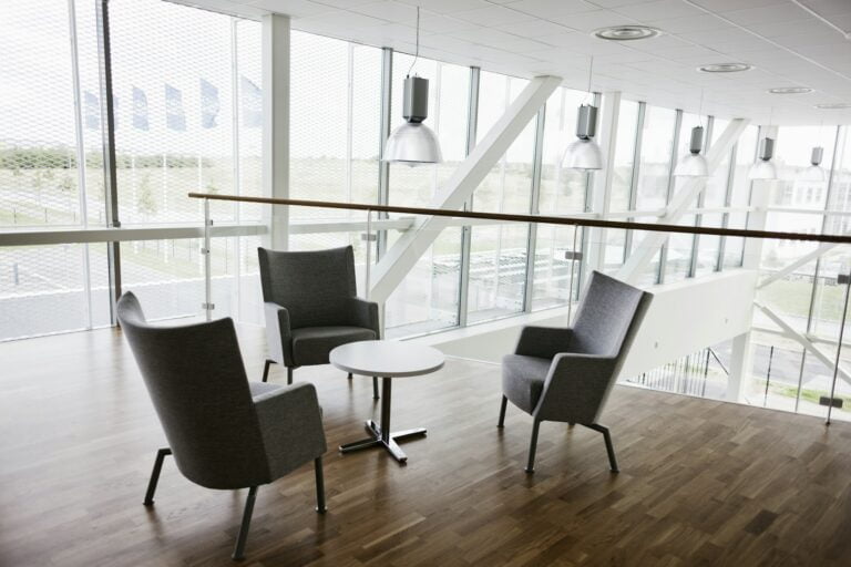 Empty chairs and table in contemporary office